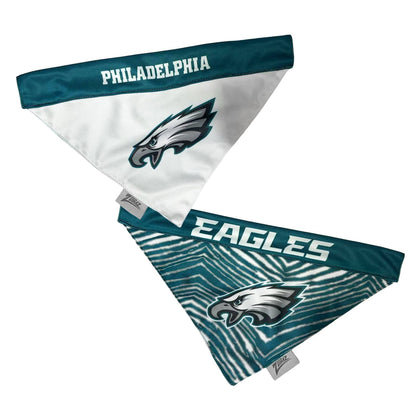 Philadelphia Eagles dog bandana featuring a white triangular body with the team's eagle logo and 'PHILADELPHIA' text on a navy blue top band, shown on a plain white background.